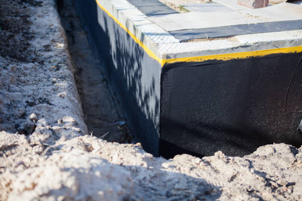 Professional Basement Waterproofing technician working in Wheatfield, IN